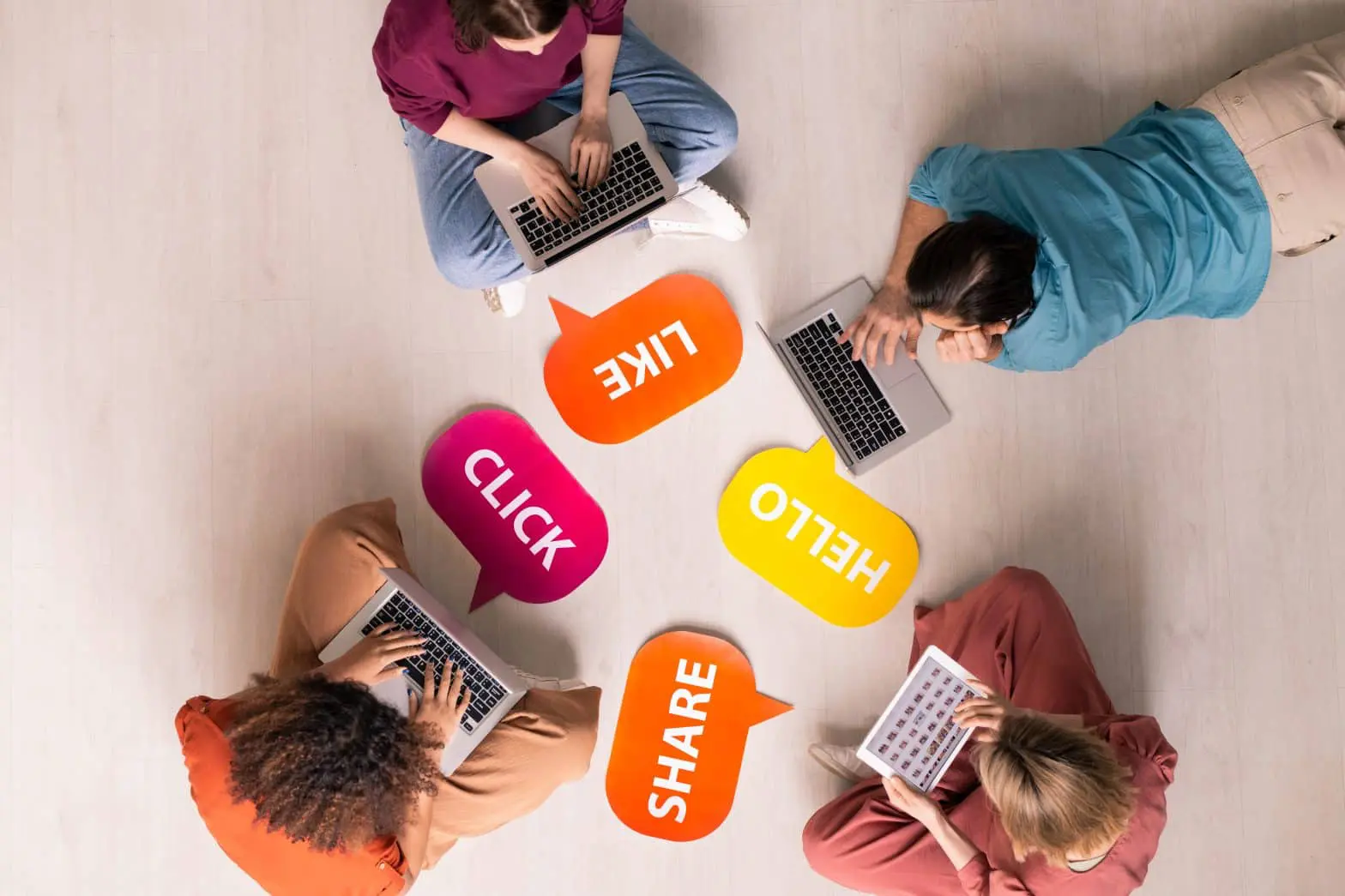 a group of people using laptops