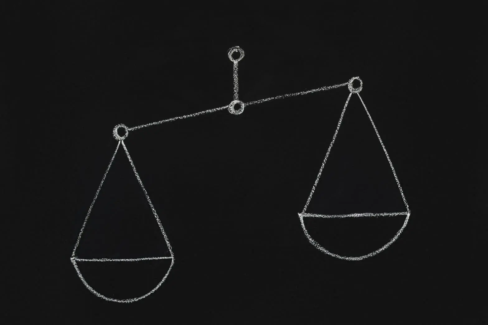 a chalk drawing of a balance scale