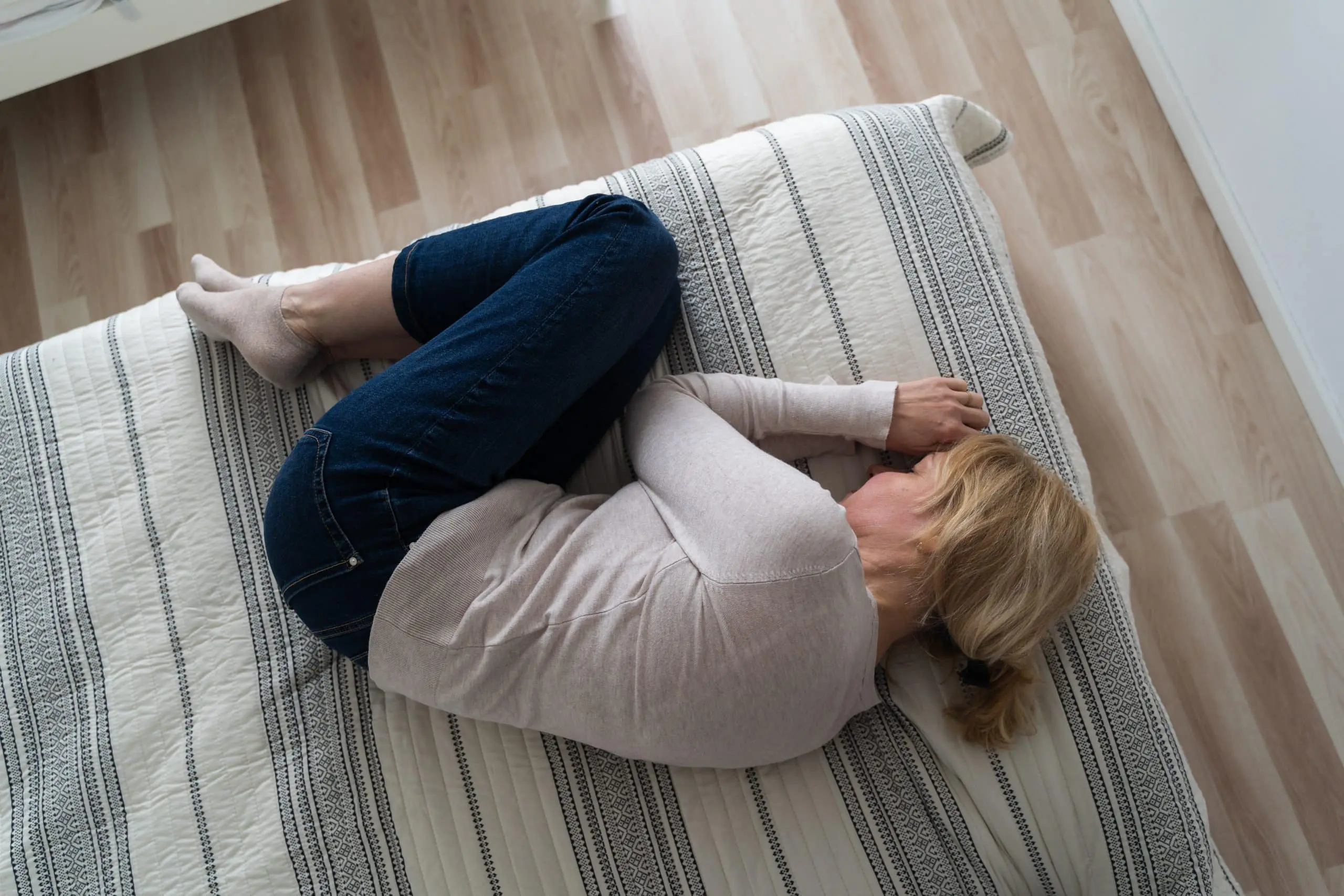 a woman lying on a bed