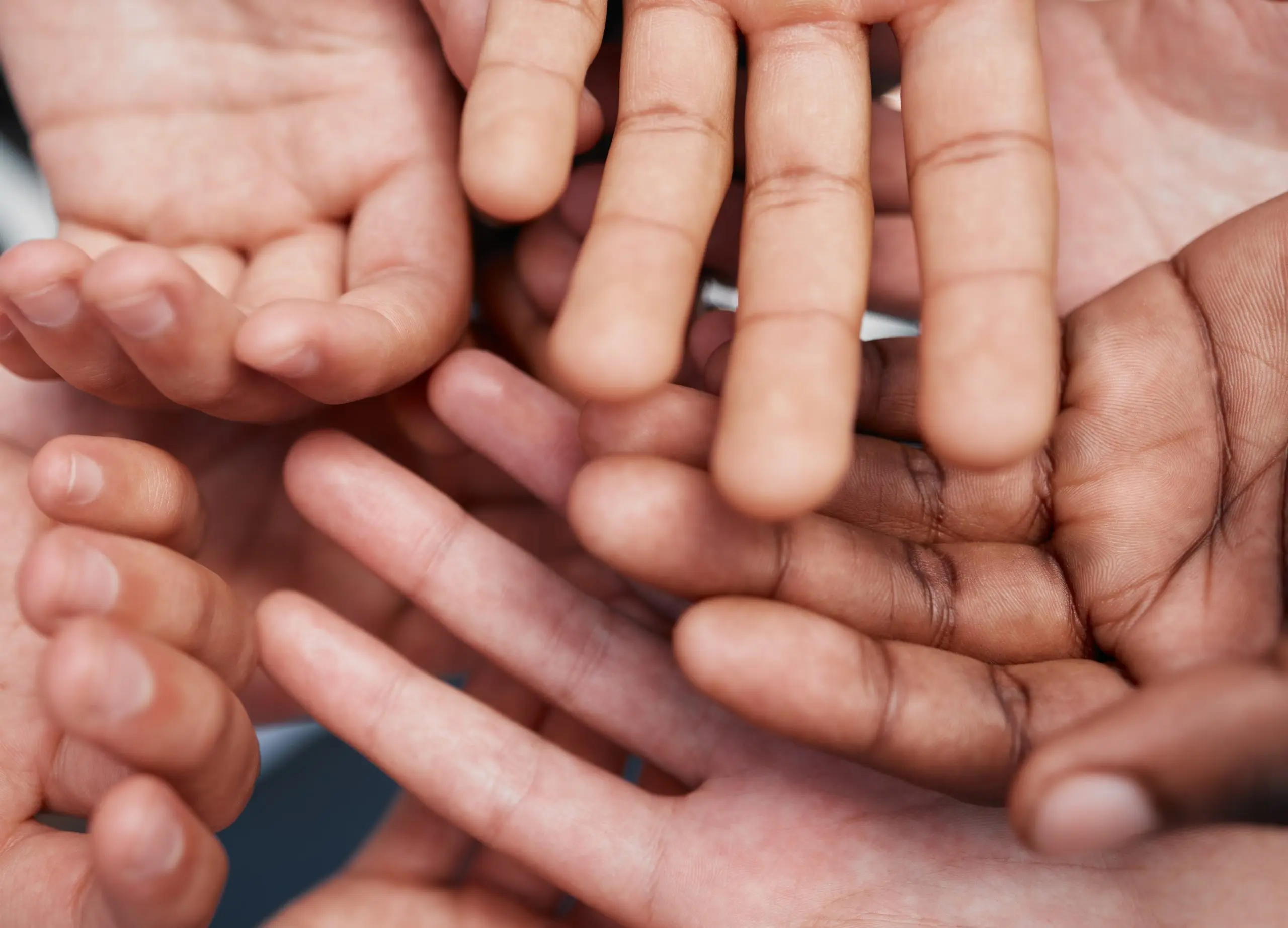 a group of hands with fingers extended