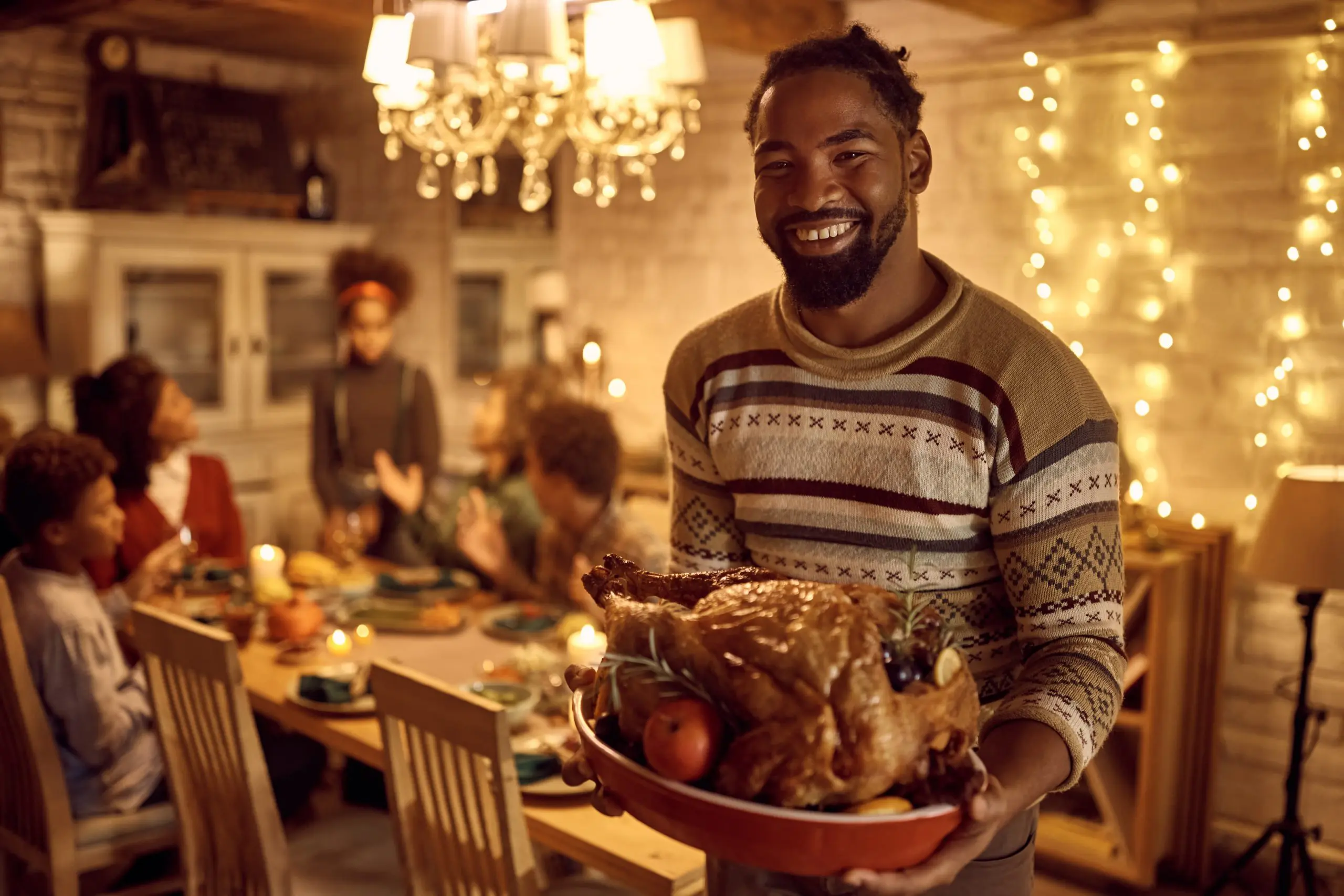 a man holding a platter of food