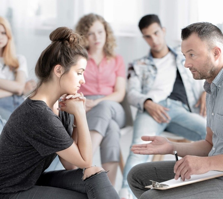 a man talking to a woman